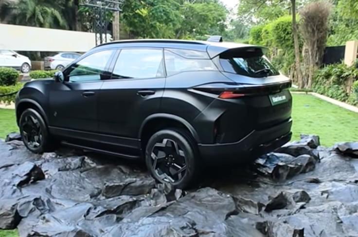 It comes finished in a matte black exterior paint shade which looks quite sinister. Tata Harrier EV Stealth Edition rear quarter